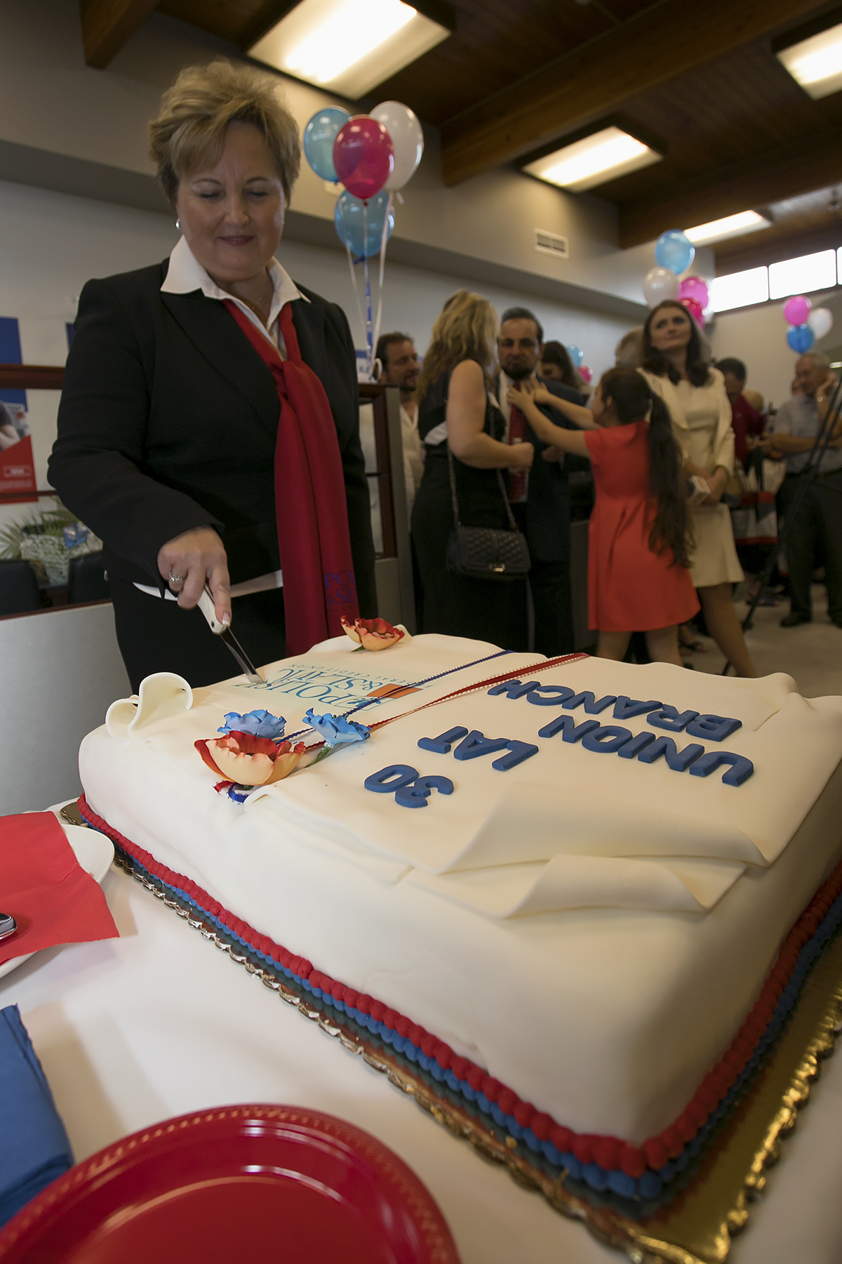 PSFCU 30th Anniversary cutting cake